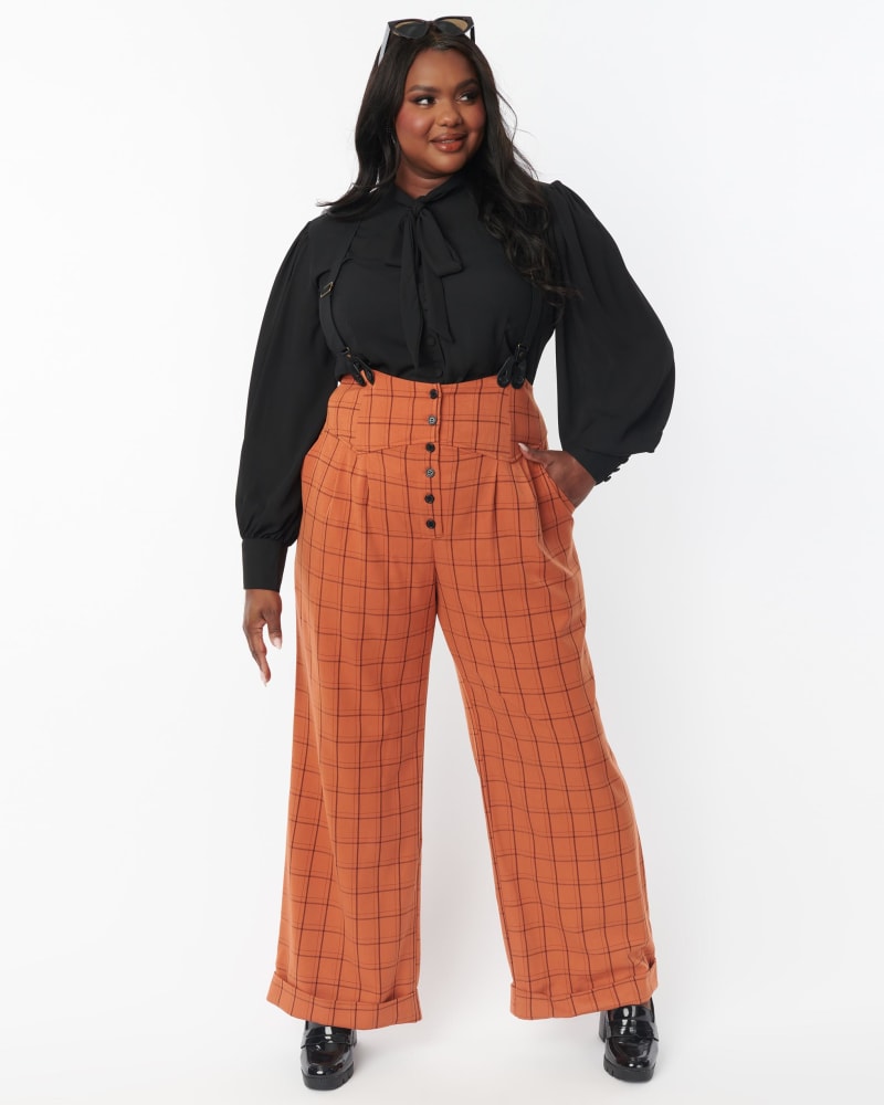 Front of a model wearing a size L Unique Vintage Plus Orange Windowpane Thelma Suspender Pants in Orange by Unique Vintage. | dia_product_style_image_id:310203